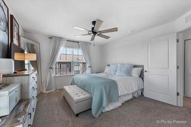 carpeted bedroom featuring ceiling fan