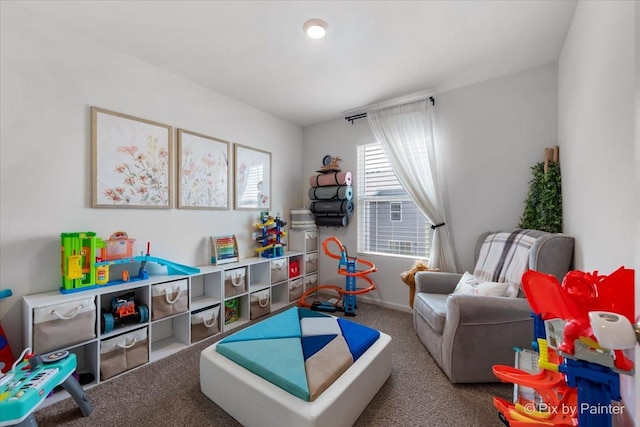 recreation room with carpet flooring