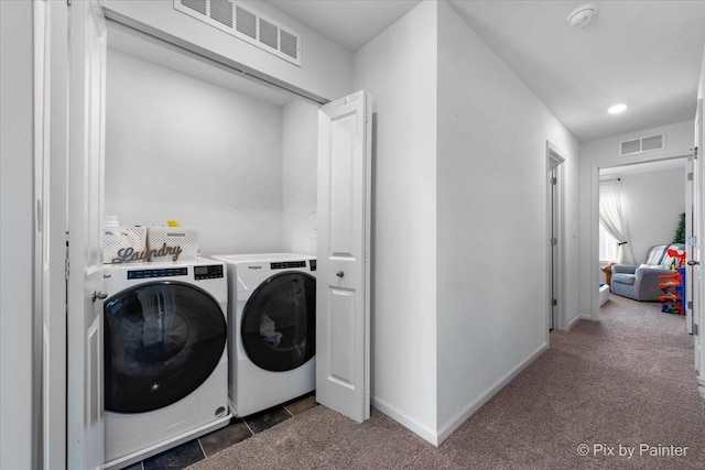 laundry room featuring washer and clothes dryer, carpet floors, and baseboards
