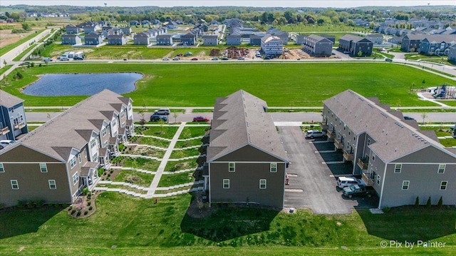 aerial view of residential area with a nearby body of water
