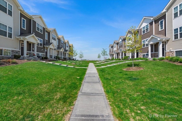 surrounding community featuring a residential view and a lawn