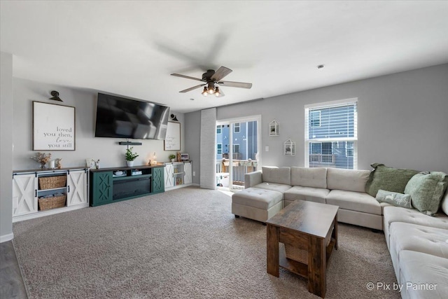 living room featuring ceiling fan