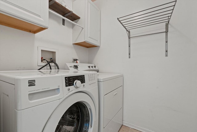 12777 W Wakefield Dr, Beach Park, IL 60083 - laundry area featuring cabinet space and separate washer and dryer