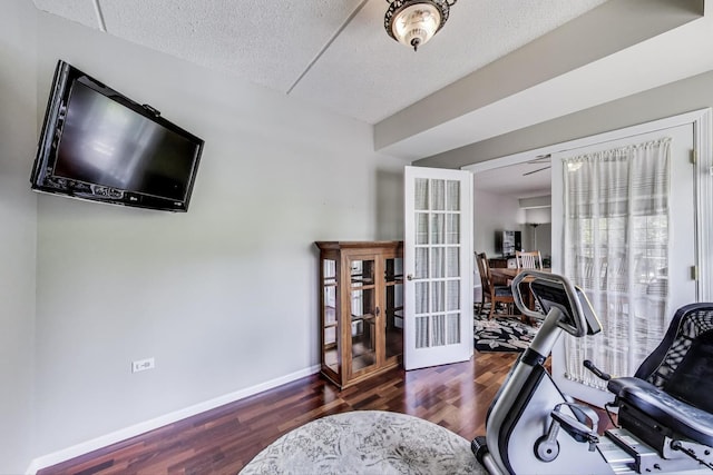 440 W Mahogany Ct Unit 209, Palatine, IL 60067 - exercise room with french doors, wood finished floors, a textured ceiling, and baseboards