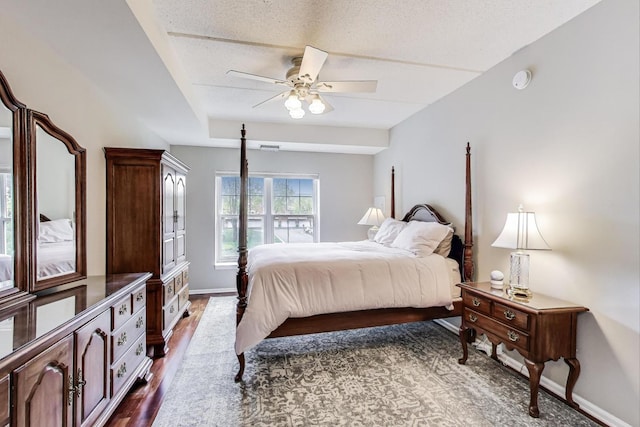 440 W Mahogany Ct Unit 209, Palatine, IL 60067 - bedroom featuring baseboards, a ceiling fan, and dark wood-style flooring