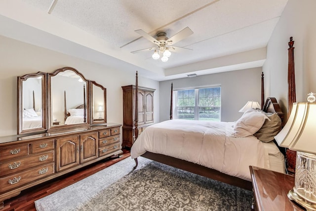 440 W Mahogany Ct Unit 209, Palatine, IL 60067 - bedroom with dark wood-style floors, a textured ceiling, and ceiling fan