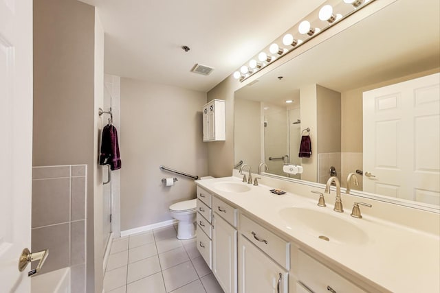 440 W Mahogany Ct Unit 209, Palatine, IL 60067 - bathroom featuring tile patterned floors, a shower with shower door, toilet, baseboards, and double vanity