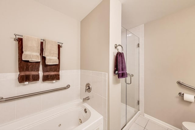 440 W Mahogany Ct Unit 209, Palatine, IL 60067 - bathroom with a stall shower, a tub with jets, tile patterned floors, and toilet