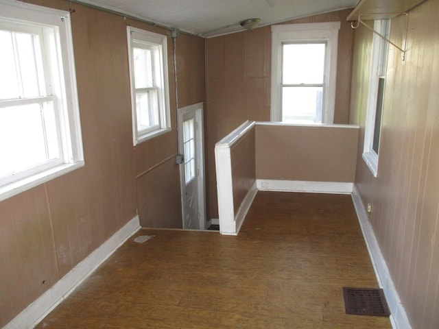 entrance foyer featuring wood finished floors and baseboards