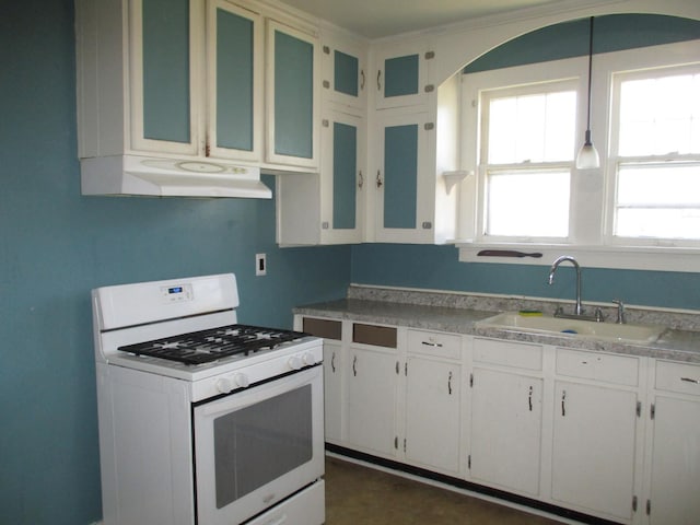 kitchen with gas range gas stove, a sink, under cabinet range hood, white cabinetry, and light countertops