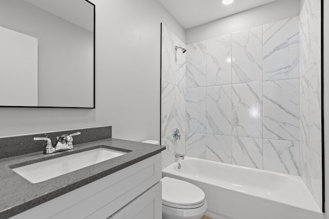 bathroom featuring toilet, bathing tub / shower combination, and vanity