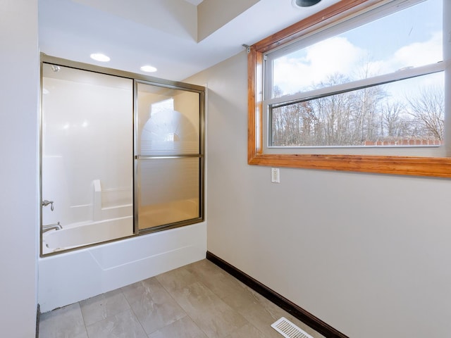 full bathroom featuring bath / shower combo with glass door, baseboards, and recessed lighting