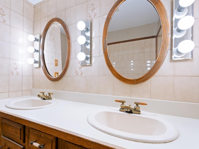 bathroom with tile walls, double vanity, and decorative backsplash
