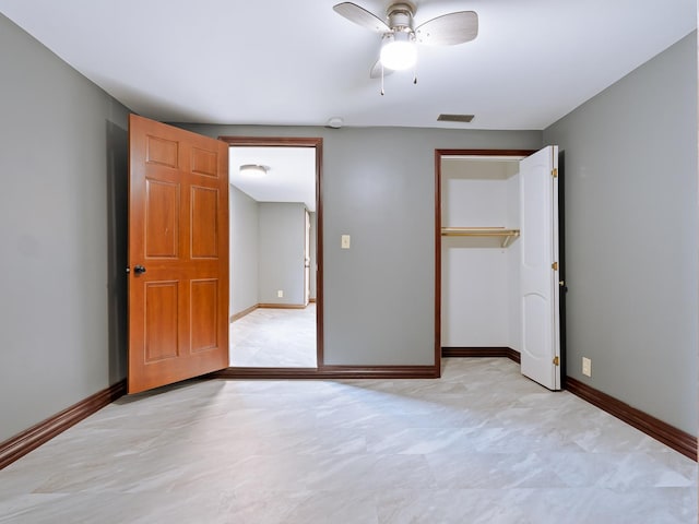 unfurnished bedroom featuring a closet, baseboards, and ceiling fan