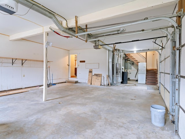 garage with a garage door opener and refrigerator