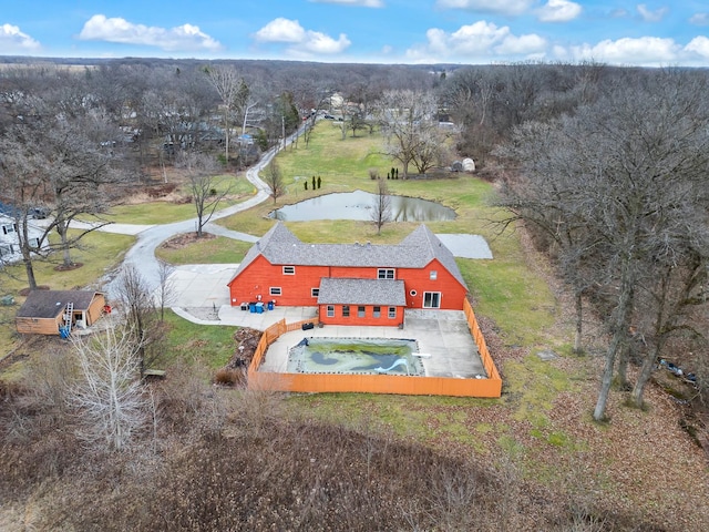 aerial view of property and surrounding area with a large body of water