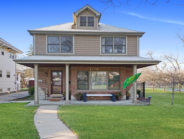 2153 W 107th Pl, Chicago, IL 60643 - american foursquare style home featuring covered porch, a front lawn, brick siding, and a shingled roof