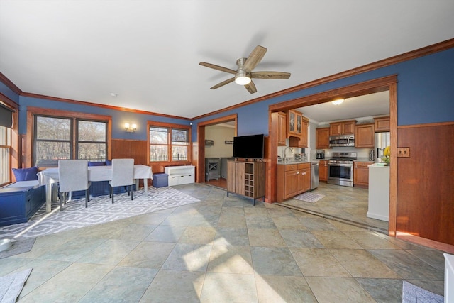 2153 W 107th Pl, Chicago, IL 60643 - living area with a ceiling fan, crown molding, wooden walls, and wainscoting