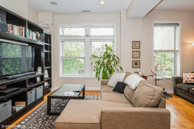 2232 W Homer St, Chicago, IL 60647 - living area featuring wood finished floors, baseboards, and recessed lighting