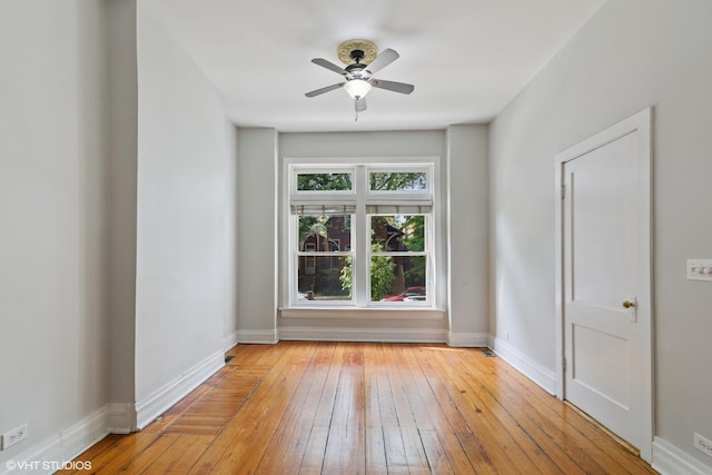 2232 W Homer St, Chicago, IL 60647 - unfurnished room with light wood finished floors, a ceiling fan, and baseboards