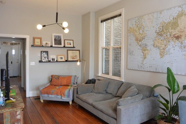 2232 W Homer St, Chicago, IL 60647 - living area featuring wood-type flooring, a chandelier, and baseboards