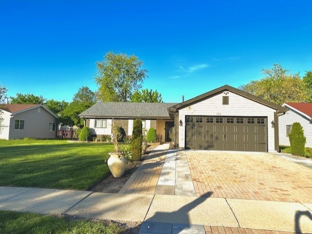 228 Janes Ave, Bolingbrook, IL 60440 - ranch-style house featuring a front yard, a garage, and driveway