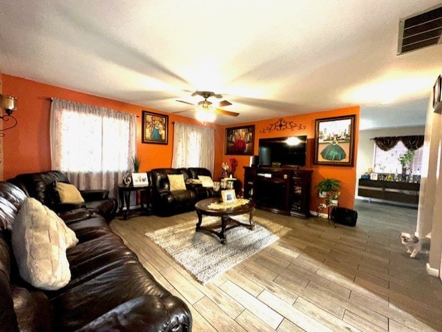 228 Janes Ave, Bolingbrook, IL 60440 - living room featuring a ceiling fan, plenty of natural light, and wood finished floors