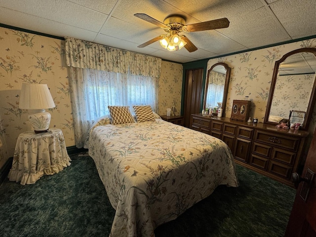 bedroom featuring wallpapered walls, dark carpet, and ceiling fan
