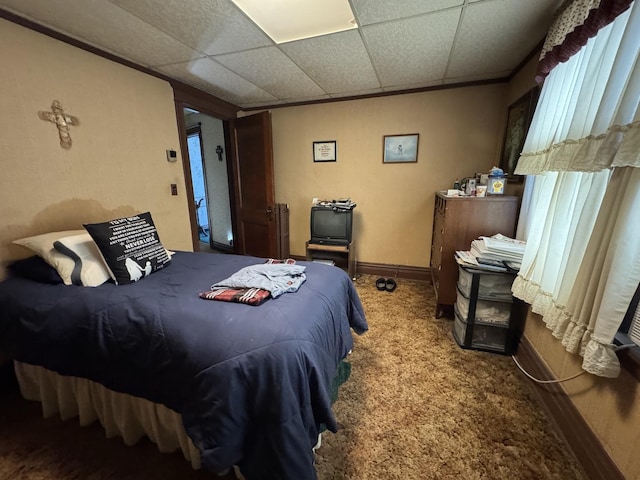 bedroom featuring carpet and baseboards