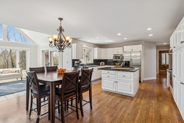 3937 Lakeview Ct, Long Grove, IL 60047 - dining area featuring a chandelier, recessed lighting, wood finished floors, and baseboards