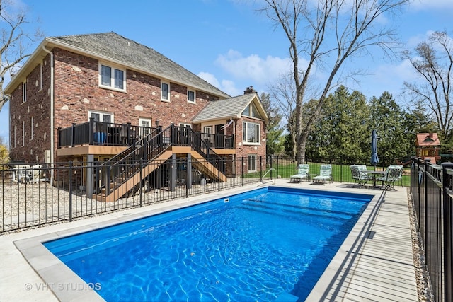 3937 Lakeview Ct, Long Grove, IL 60047 - view of pool with stairway, a wooden deck, fence, and a patio area