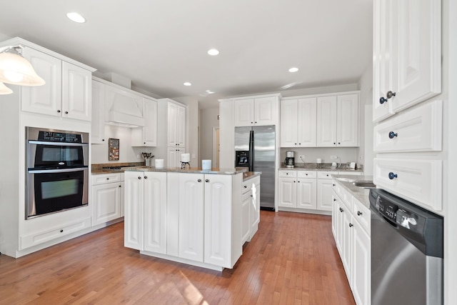 2904 Portage St, Naperville, IL 60564 - kitchen with stainless steel appliances, light wood-type flooring, white cabinets, a center island, and recessed lighting