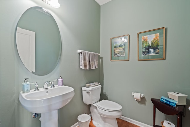 2904 Portage St, Naperville, IL 60564 - bathroom with wood finished floors, toilet, baseboards, and a sink