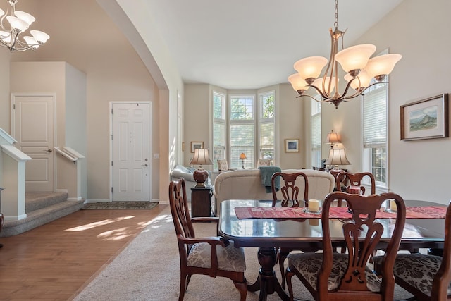2904 Portage St, Naperville, IL 60564 - dining room with a chandelier, arched walkways, wood finished floors, and baseboards