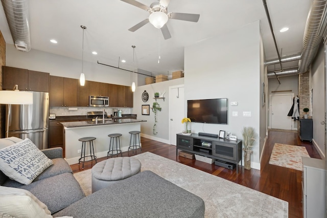 3133 N Lakewood Ave Unit 3I, Chicago, IL 60657 - living room with dark wood-type flooring, a high ceiling, ceiling fan, baseboards, and recessed lighting