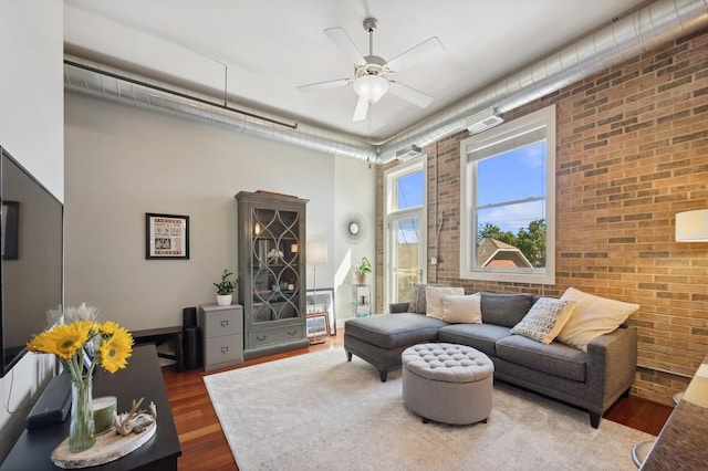3133 N Lakewood Ave Unit 3I, Chicago, IL 60657 - living area featuring brick wall, wood finished floors, a ceiling fan, and a towering ceiling