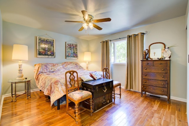 2006 Bristol Ct, Naperville, IL 60565 - bedroom featuring baseboards, wood finished floors, and ceiling fan