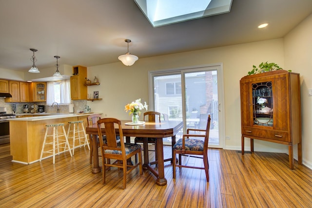 2006 Bristol Ct, Naperville, IL 60565 - dining space featuring light wood finished floors, baseboards, and recessed lighting