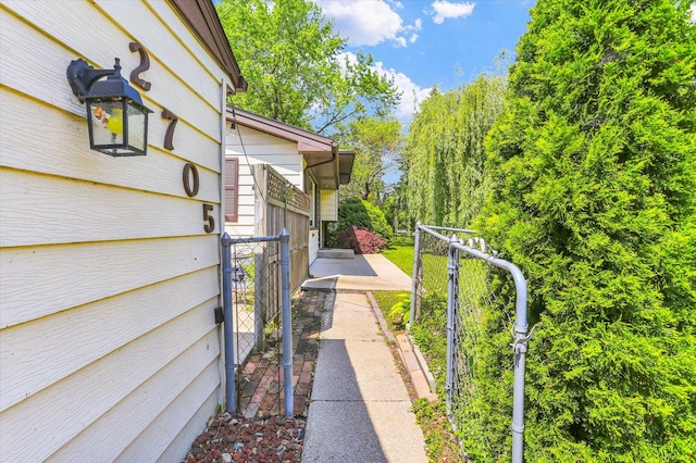view of home's exterior with fence