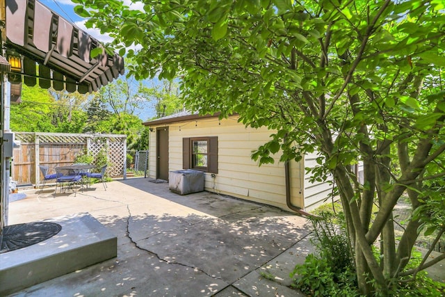 view of patio / terrace with outdoor dining space and fence