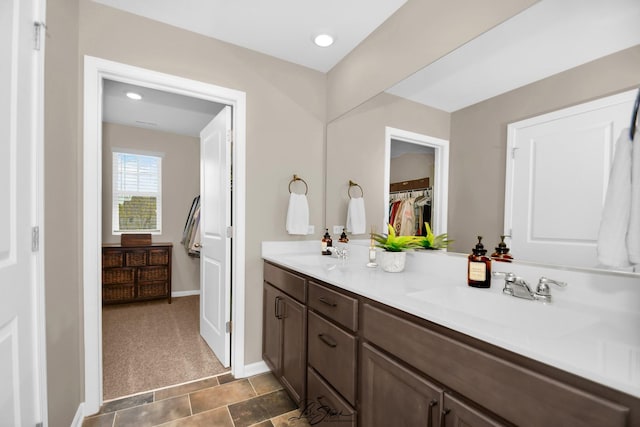 7605 Violet Ln, Joliet, IL 60431 - full bath featuring double vanity, a spacious closet, and baseboards