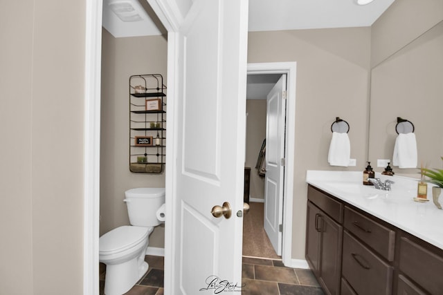 7605 Violet Ln, Joliet, IL 60431 - bathroom featuring toilet, vanity, and baseboards