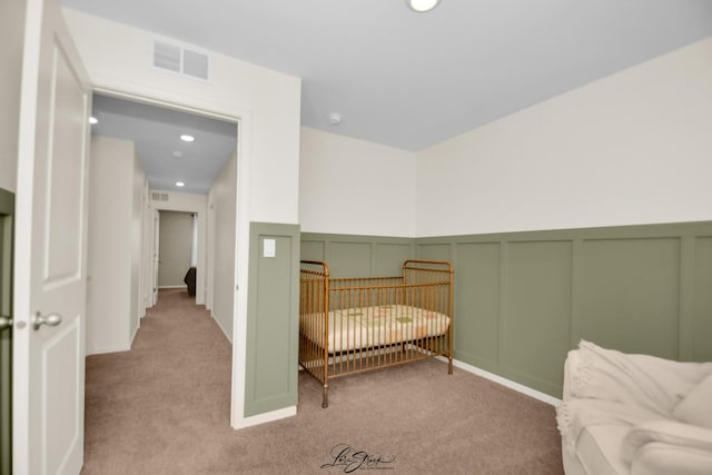 7605 Violet Ln, Joliet, IL 60431 - bedroom featuring a decorative wall, carpet flooring, wainscoting, and recessed lighting