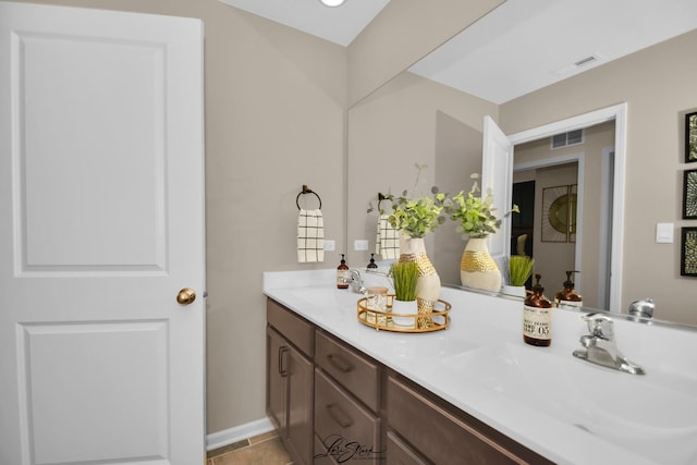 7605 Violet Ln, Joliet, IL 60431 - full bath with double vanity, tile patterned floors, and baseboards