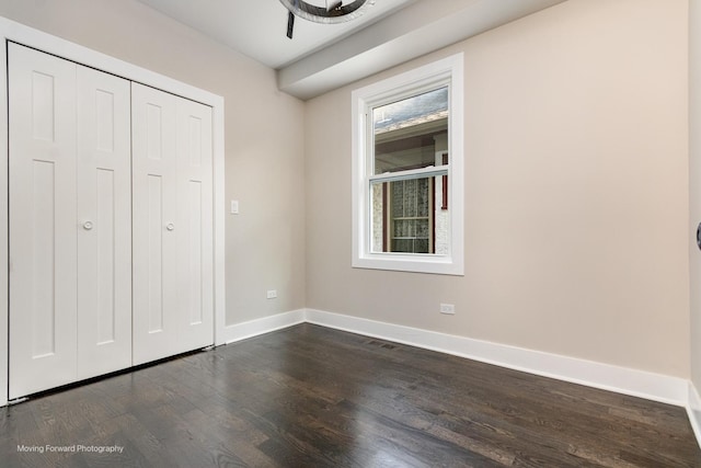 1179 S Taylor Ave, Oak Park, IL 60304 - unfurnished bedroom with dark wood-type flooring, baseboards, and a closet