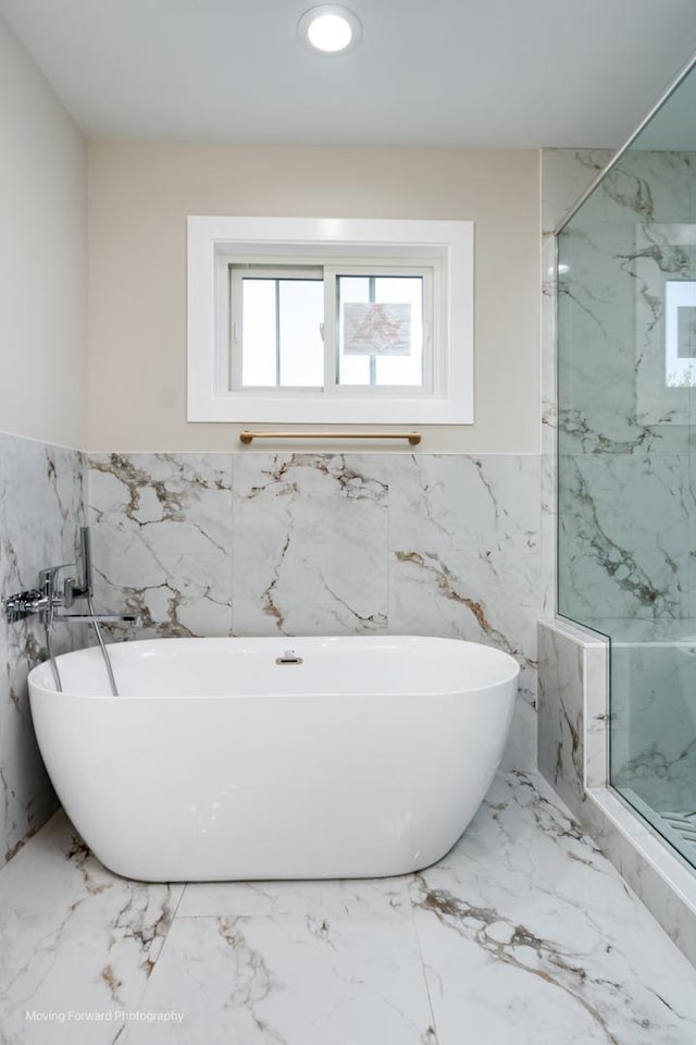 1179 S Taylor Ave, Oak Park, IL 60304 - full bath with tile walls, a marble finish shower, wainscoting, a freestanding bath, and marble finish floors