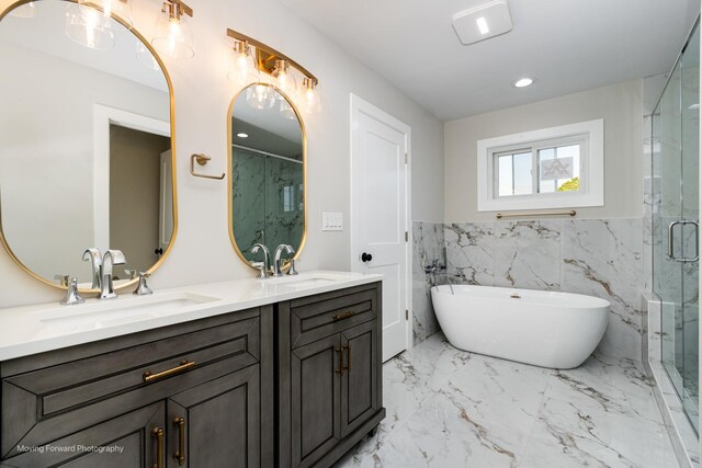1179 S Taylor Ave, Oak Park, IL 60304 - bathroom with marble tiled floors, a marble finish shower, double vanity, a soaking tub, and recessed lighting