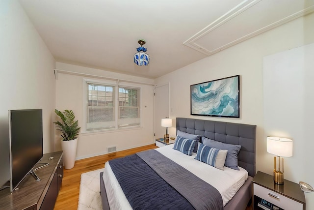 1727 Dundee Rd, Northbrook, IL 60062 - bedroom with attic access, light wood-type flooring, and baseboards