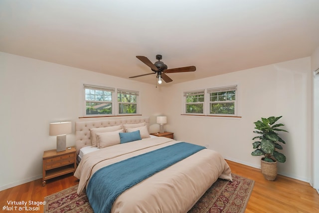1727 Dundee Rd, Northbrook, IL 60062 - bedroom featuring light wood finished floors, baseboards, and ceiling fan