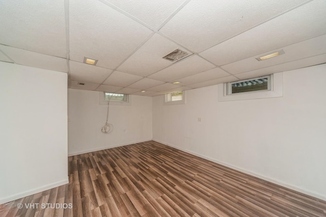 1727 Dundee Rd, Northbrook, IL 60062 - below grade area featuring wood finished floors, a paneled ceiling, and baseboards